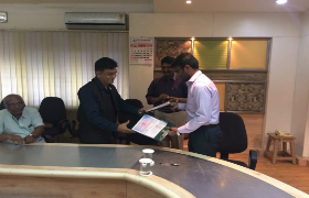 IQAG Chairman Damodar Aveli signing MOU with ESCI