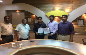 IQAG Chairman Damodar Aveli signing MOU with ESCI